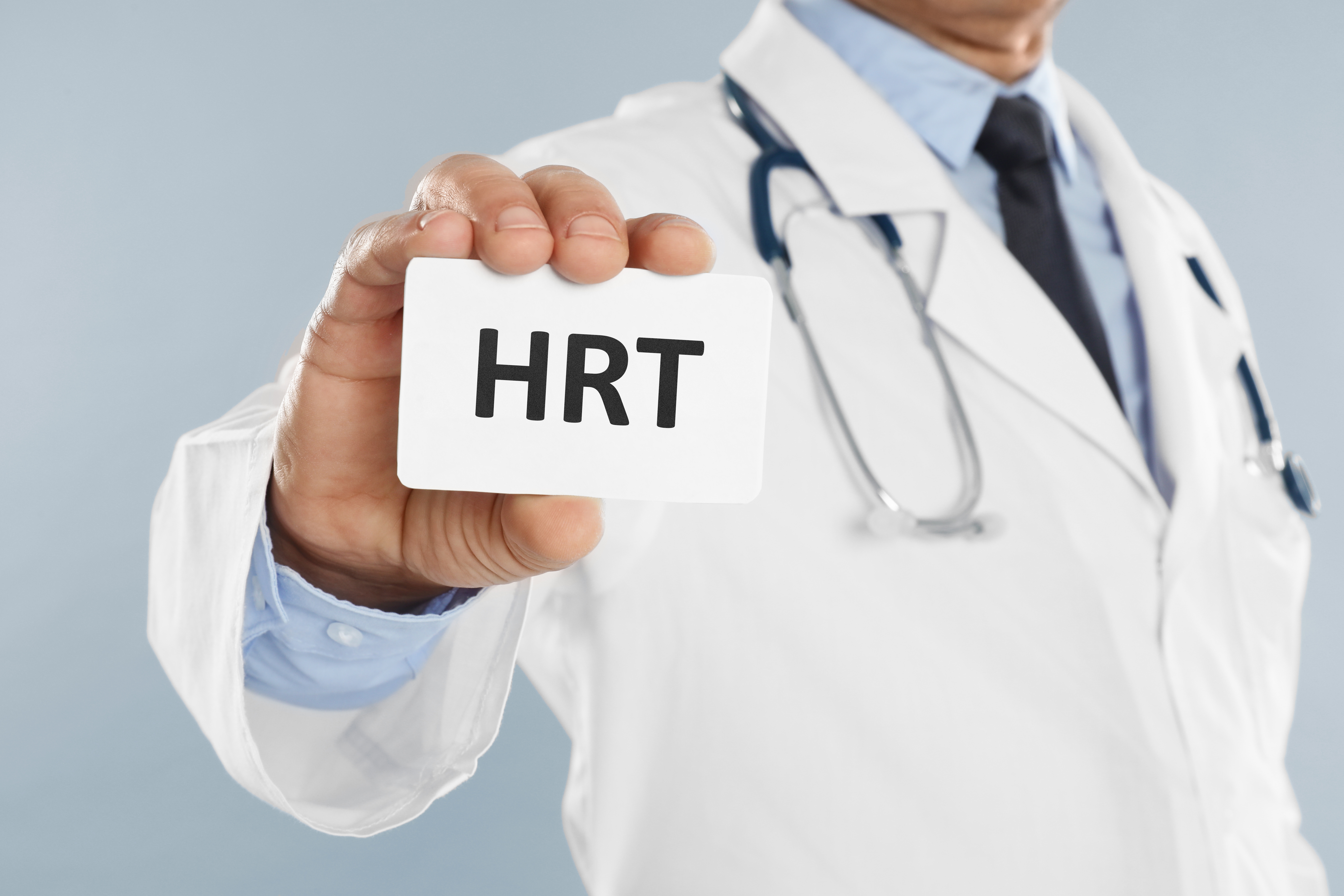 Doctor holding card with abbreviation HRT | Integrative Therapeutics